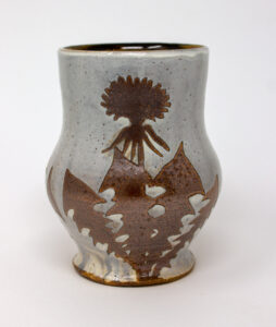 All pieces are dipped in slip, bisque fired, hand painted with wax resist designs, and dipped in a contrasting slip.
