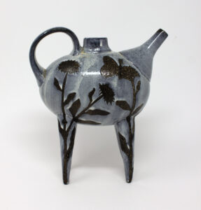 All pieces are dipped in slip, bisque fired, hand painted with wax resist designs, and dipped in a contrasting slip.
