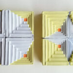 Referencing traditional quilting squares, "(Im)mutability" upholds the beauty of textiles while shifting the typically soft forms to hard blocks that can be rearranged. The shift questions the permanence of comfort & belonging while showing that if one formation is lost, a new pattern can be created