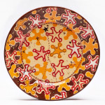 Sheriff Stars Dessert Plate, 2014. Ceramic, slip, underglaze, glaze and luster. Multi-colored screen printed underglaze transfers, shellac resist and multi-fired in an electric kiln. 1.25 x 7.25