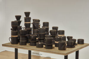 In the MFA exhibition the viewer is initially introduced to a tablescape of pots. With the design of the tables at the forefront of the space, one can see a collection of objects that are stacked in a variety of ways that allow the audience to see the complete versatility of the functional pieces – by giving this lens to the viewer, they, in turn, can visualize what they find appropriate for their stackable series, within the parameters of their living space.