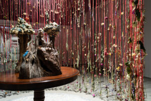 Illusive Charm: Tales of Magic and Dreams is an installation consisting of 3,000 dried flowers, ceramic sculpture and other natural material. The installation is about the illusive charm society has over our culture and the false safety for women.