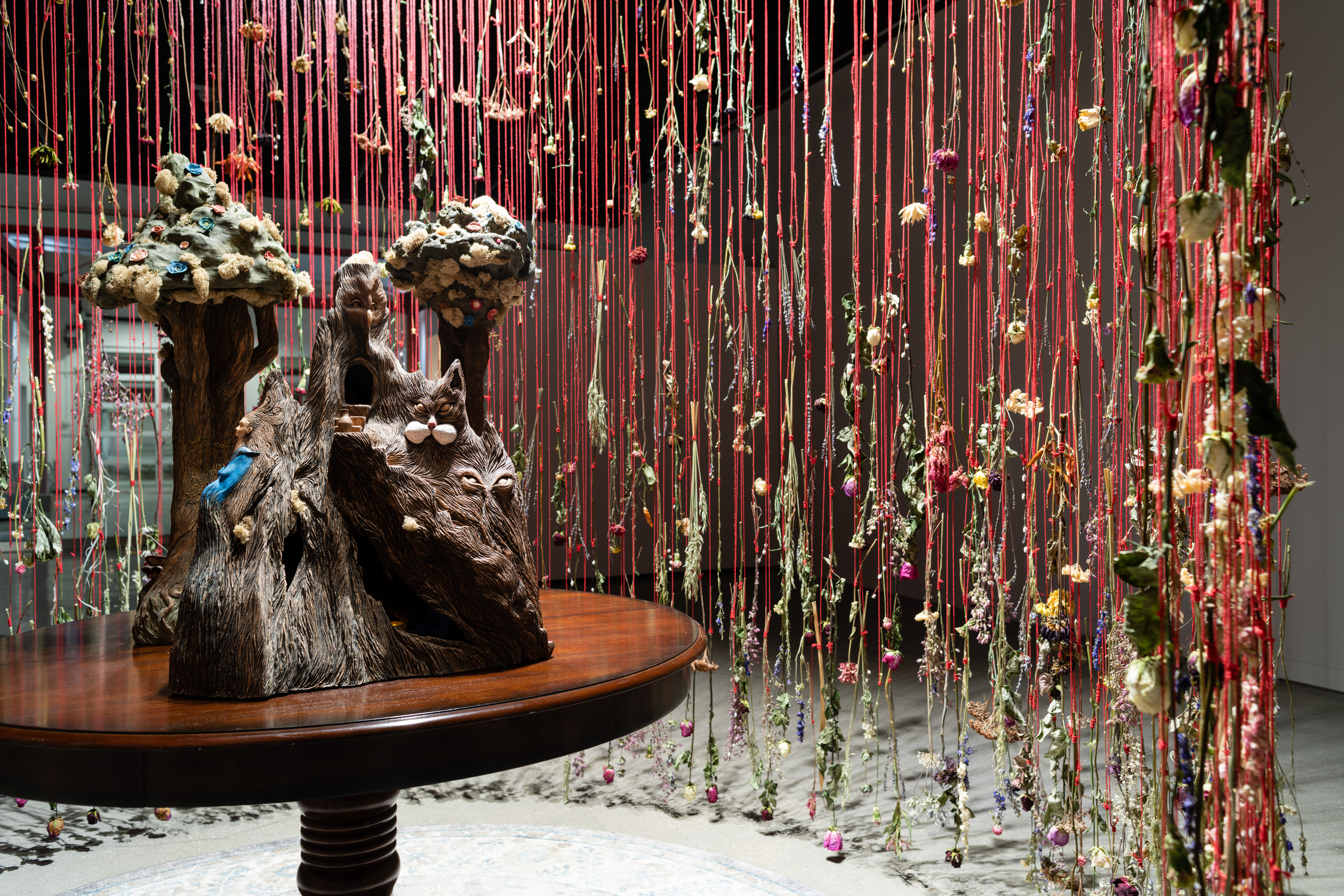 Illusive Charm: Tales of Magic and Dreams is an installation consisting of 3,000 dried flowers, ceramic sculpture and other natural material. The installation is about the illusive charm society has over our culture and the false safety for women.