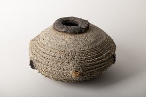 Volcanic glaze is btushed on the rim ,  gold luster brushed on the texture edges.