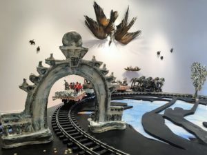 - installation work in 2016 solo exhibition When Horses Walked on Water at Craft Ontario Gallery, Toronto- Procession - porcelain sculptures incorporated with electric train parts - a series of parade floats is based on period illustrations depicting the historical tableaux displayed in the procession in honour of Toronto's semi-centennial of 1884- Cormorant Weather - body - porcelain; wings - tree seeds, cattails, epoxy resin- constructed wings using the long reed from the native water plant (cattail) and seed pods from trees, attached to sculptural body- exploring the relationship to nature and industrial development through bird imagery, from historical photographs of lakes and geography in Canadian cities prior to their major industrial development, depicting large swaths of marsh wetland