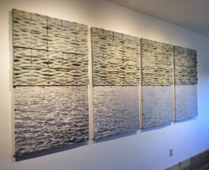 These tiles are slip cast. I create my molds by 3D printing prototypes that I cast plaster molds around. My designs are created in Rhino by using a heightfield image, translating a photograph into virtual surfaces that I digitally sculpt into tile forms. 
The tiles hang above archival print photographs.