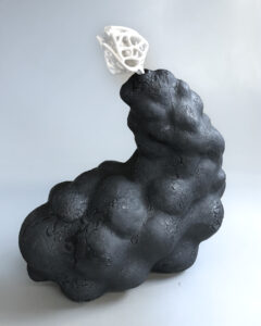 Unglazed, mid-range porcelain  'bone-flower' emerges from the  glazed, mid-range stoneware  biomorphic form