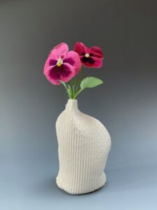 The work was made from flat cellulose sponges that have been sewn together to make soft, single use molds for porcelain slip.