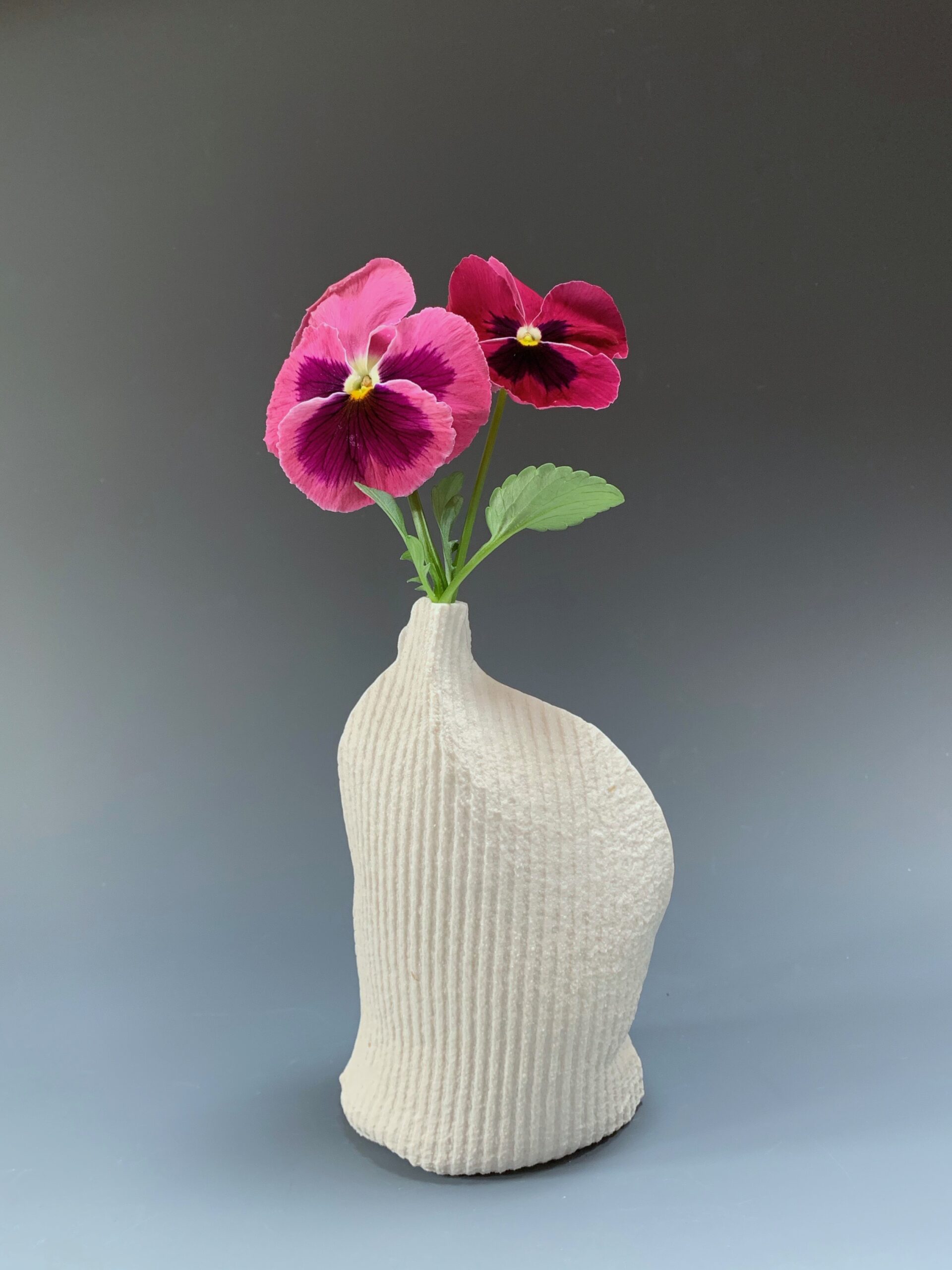 The work was made from flat cellulose sponges that have been sewn together to make soft, single use molds for porcelain slip.
