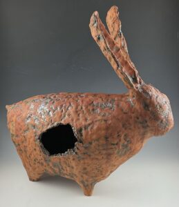 This ceramic sculpture echoes the deep past by creating a hole that appears to be knocked into the center of the form, echoing the way shards are formed in the aging process. The rabbit in this work is meant to draw attention to the emptiness of a form that is an important marker for the health of ecosystems, in that we share similar preferences for ecotones as these animals, in proximity to open field, forest, and water source.