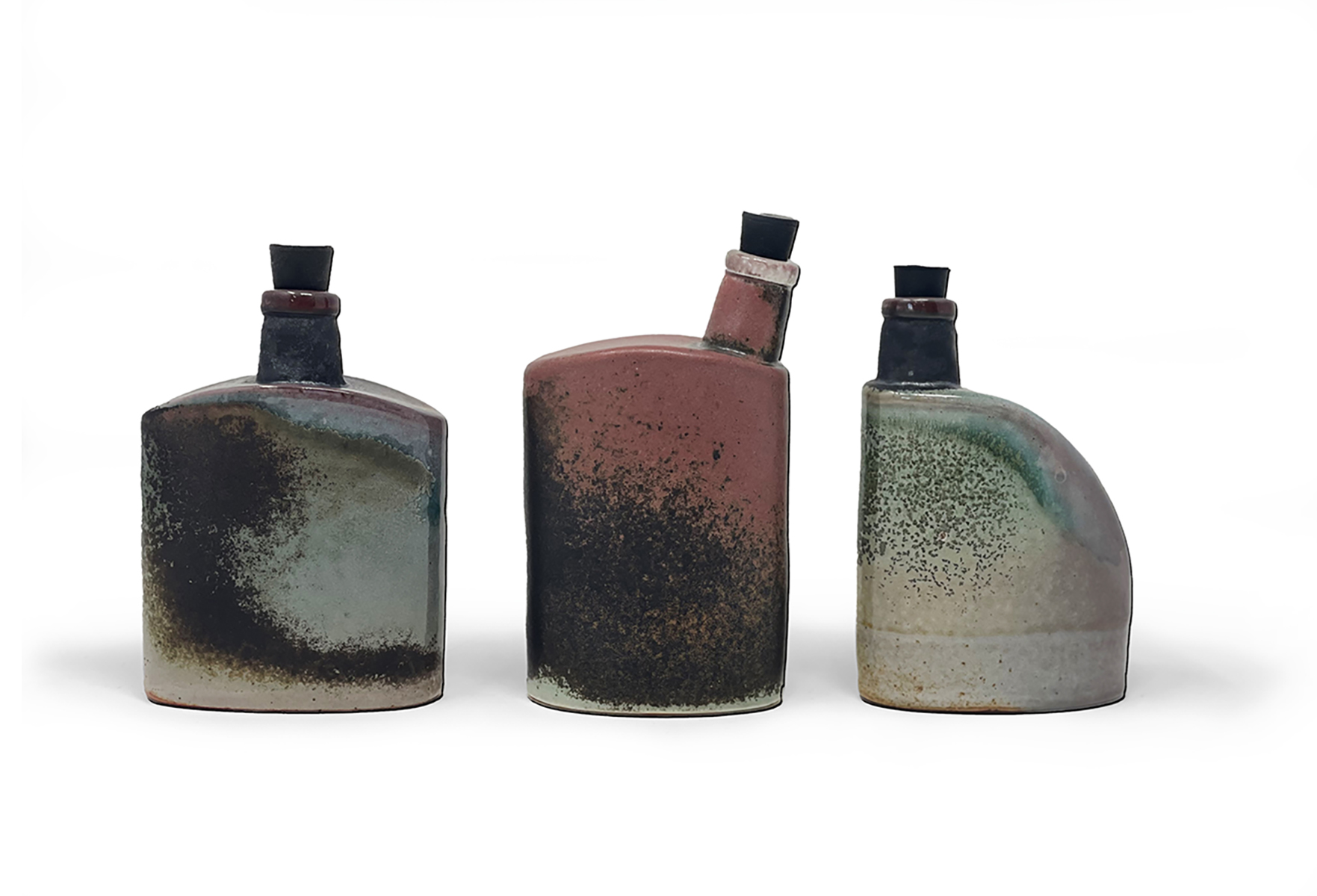 From the ongoing "Hooch" series. Inspired by the old tools, bottles, cans and oddities I remember from my great grandfather's garage. Ceramic flasks with rubber stoppers for easy beverage  transport .