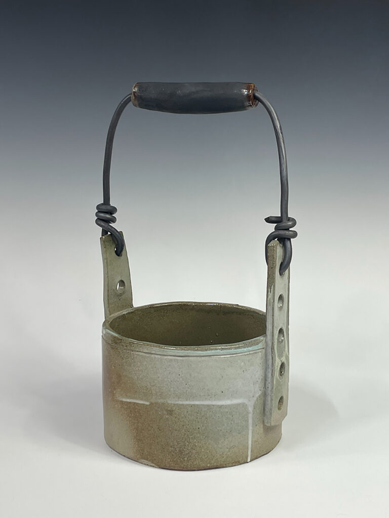 From the "Propagation" exhibition. New ceramic work revisiting an older series of mixed media works (photography, encaustic, found objects) inspired by an abandoned greenhouse in the Dutch village where I once lived. The new ceramic works reference the tools and utilitarian vessels I remember from the site. Lead wire and recycled hand tool handle.