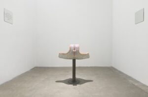 2020, Terracotta, Rhinestones, Sandblasted Mirror, Steel 

https://youtu.be/2BFHxu0qakQ 

I am interested in the identity duality of a mascuine born body, and its relation to the spaces that it specifically has to exist in, creating a space that is both hyper personal and extremely detached.I want to explore this part of my identity that I am tied to because of my male born body and how being raised in that way and how those spaces influenced how I developed an understanding of myself. 
The public bathroom is a public and private space. The Urinal is designed for the use of male born bodies, and In the development of a male person's identity they become a sort of rite of passage into “manhood.”  In itself the urinal is just a vessel, or depository for a human's by-product but in its layout, design, usual proximity to one another forces a confrontation and examination. The public bathroom becomes a stage and an arena for the performability to one's masculinity, forcing comparisons.