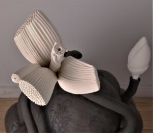 Slipcast parts, assembled, then further carved