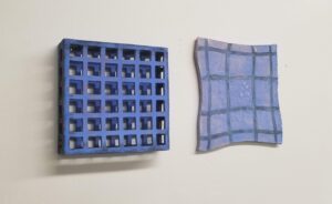 “Underpinning” shows two iterations of a grid, one that is supported through connections and a second that has been stretched thin with no support, distorting the geometry. The work illustrates the consequences of social division and the lack of social support.