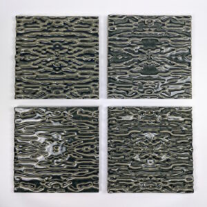 The tiles were created by pressing clay onto molds. I create my molds by using a CNC to carve them, or 3D print prototypes that I cast plaster molds around. My designs are created in Rhino by using a heightfield image, translating a photograph into virtual surfaces that I digitally sculpt into tile forms.