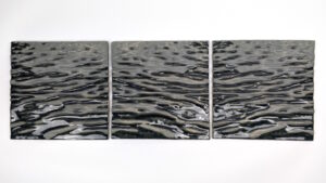 The tiles were created by pressing clay onto molds. I create my molds by using a CNC to carve them, or 3D print prototypes that I cast plaster molds around. My designs are created in Rhino by using a heightfield image, translating a photograph into virtual surfaces that I digitally sculpt into tile forms.