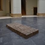 All the tiles were collected from a roof of an old house, which was condemned to demolition. Its smashed and shattered roof becomes rearranged and pieced back together to a symbolic bed – a site of rest, birth or death. Bed that incorporates the most intimate moments of life and presents a sort of tiny dwelling in the midst of a house.