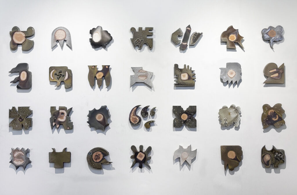 this work is a wall based installation of 21 elements fired in my train kiln for 50 hours on wood.