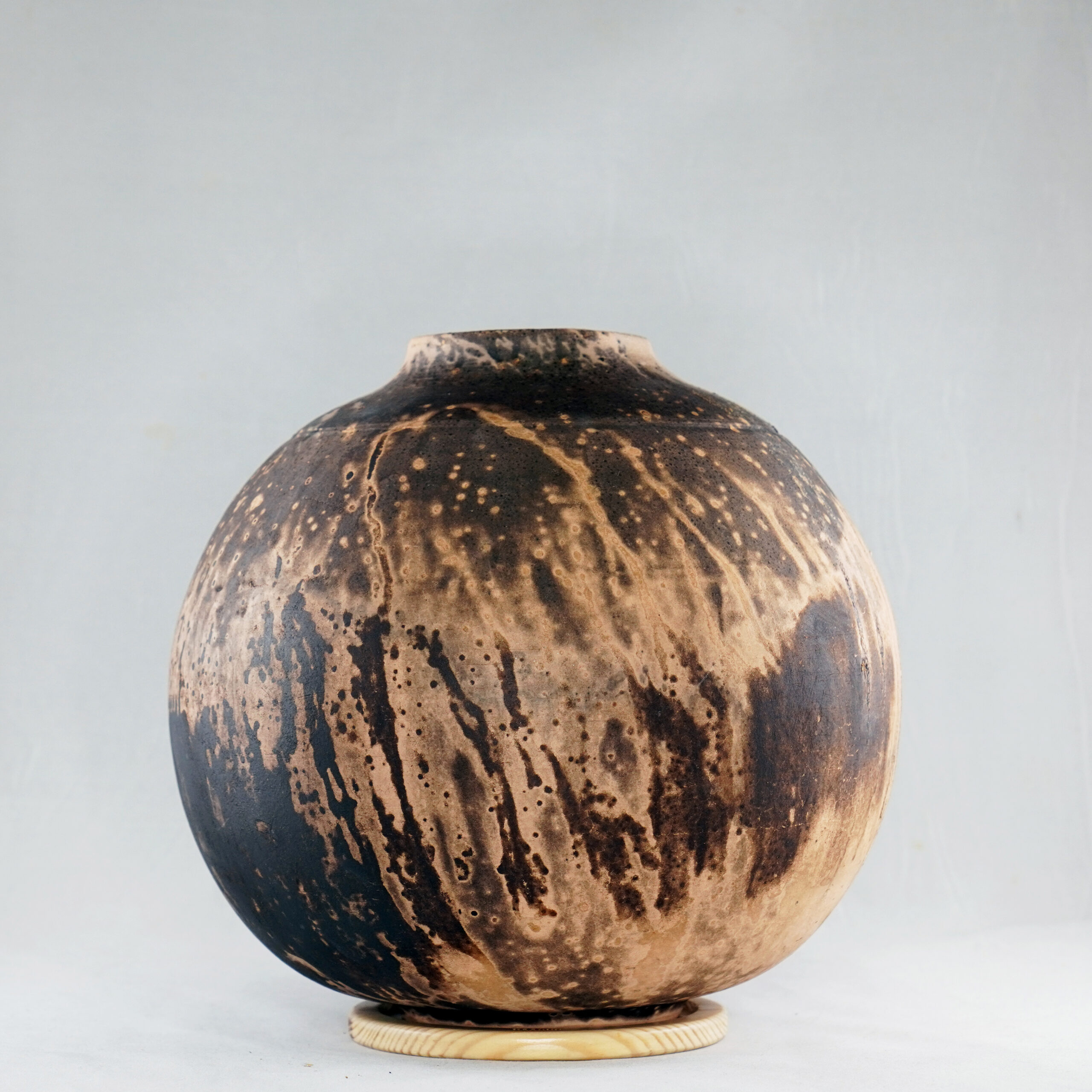 Obvara is a firing technique similar to the Raku technique, but the difference is that the vase gets dunked into a special Obvara mixture and then into water. This results in wonderful unpredictable patterns that look almost like animal prints or wood all around the vase. This technique originated from Eastern Europe and is also said to give an antique-like look to a ceramic piece.