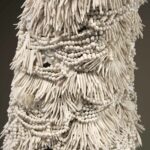 Handmade porcelain beads strung on to wire, over an armature, to create the form.