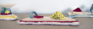 Clay.Felt.Abstraction is a series of small ceramic works with felt bases that playfully poke at the absurdity of abstraction through the use of humor.   The needle-felt bases provide contrast as well as protection and teasingly conceal the process of making.
