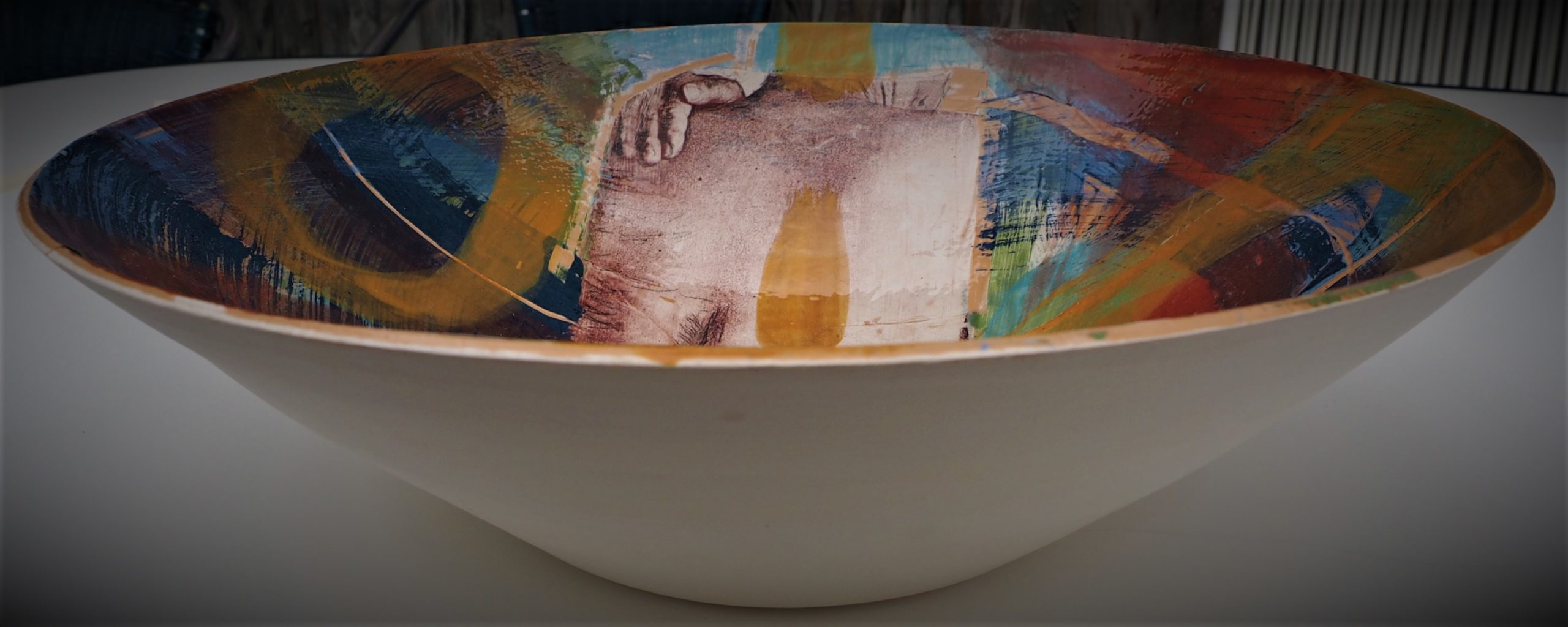 Images are fotos transfered with a monoprint technique and burned into clay.
