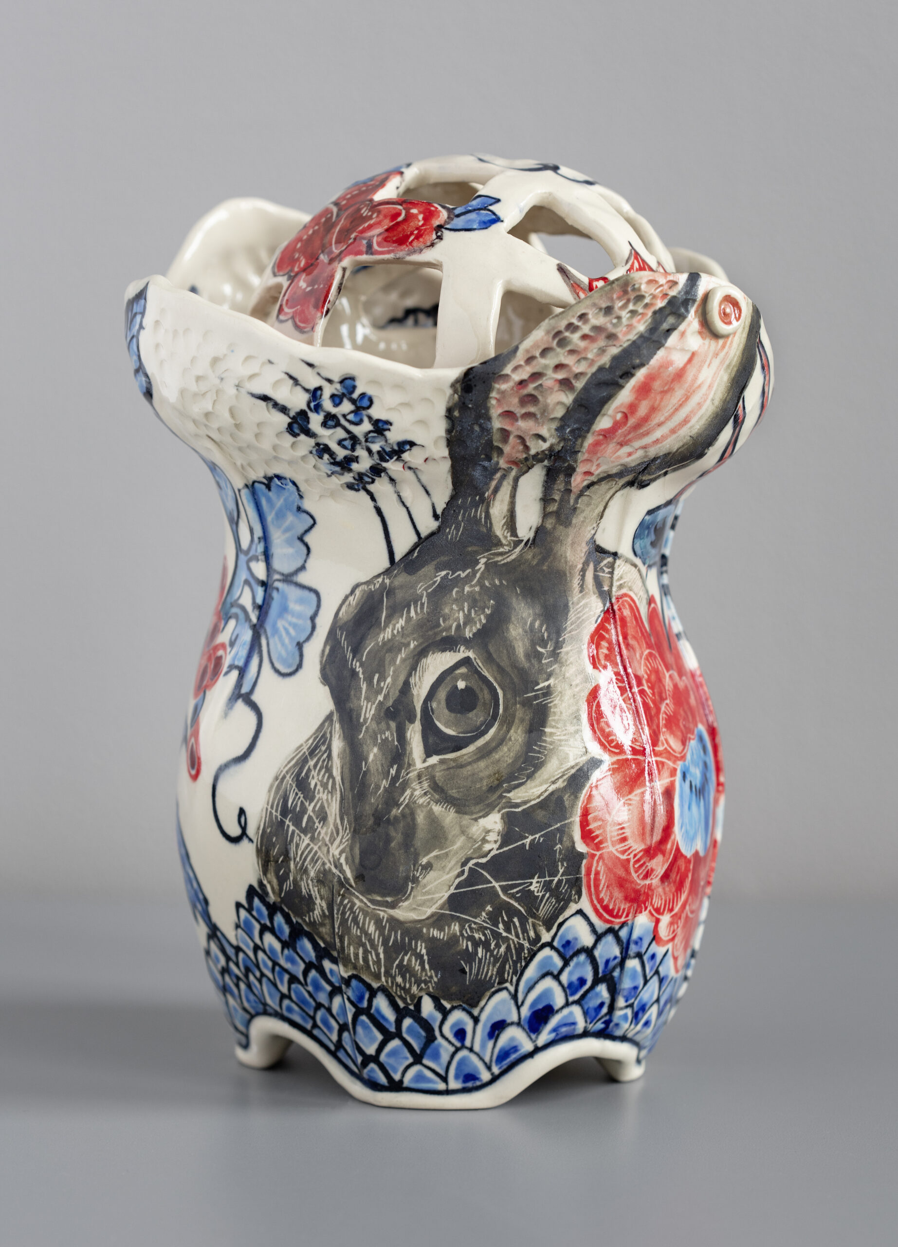 hand-painted imagery, glazed interior, animal left unglazed, matte surface