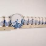 Slip cast and found-manufactured ceramic, wood, 84 x 14 x 6”