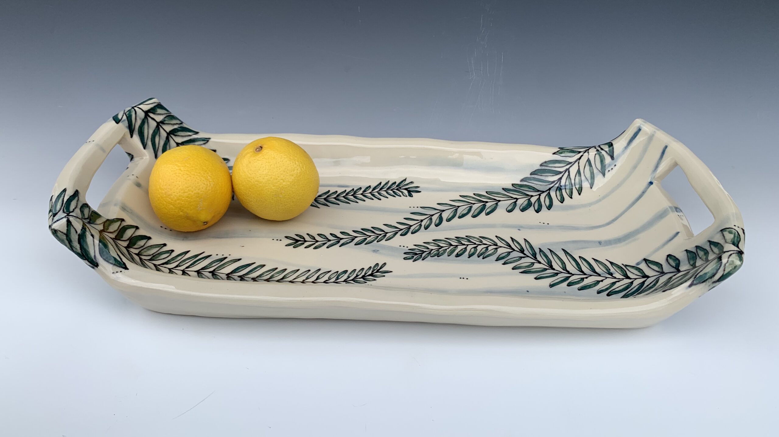 Porcelaneous stoneware, underglaze trailer and colored slip