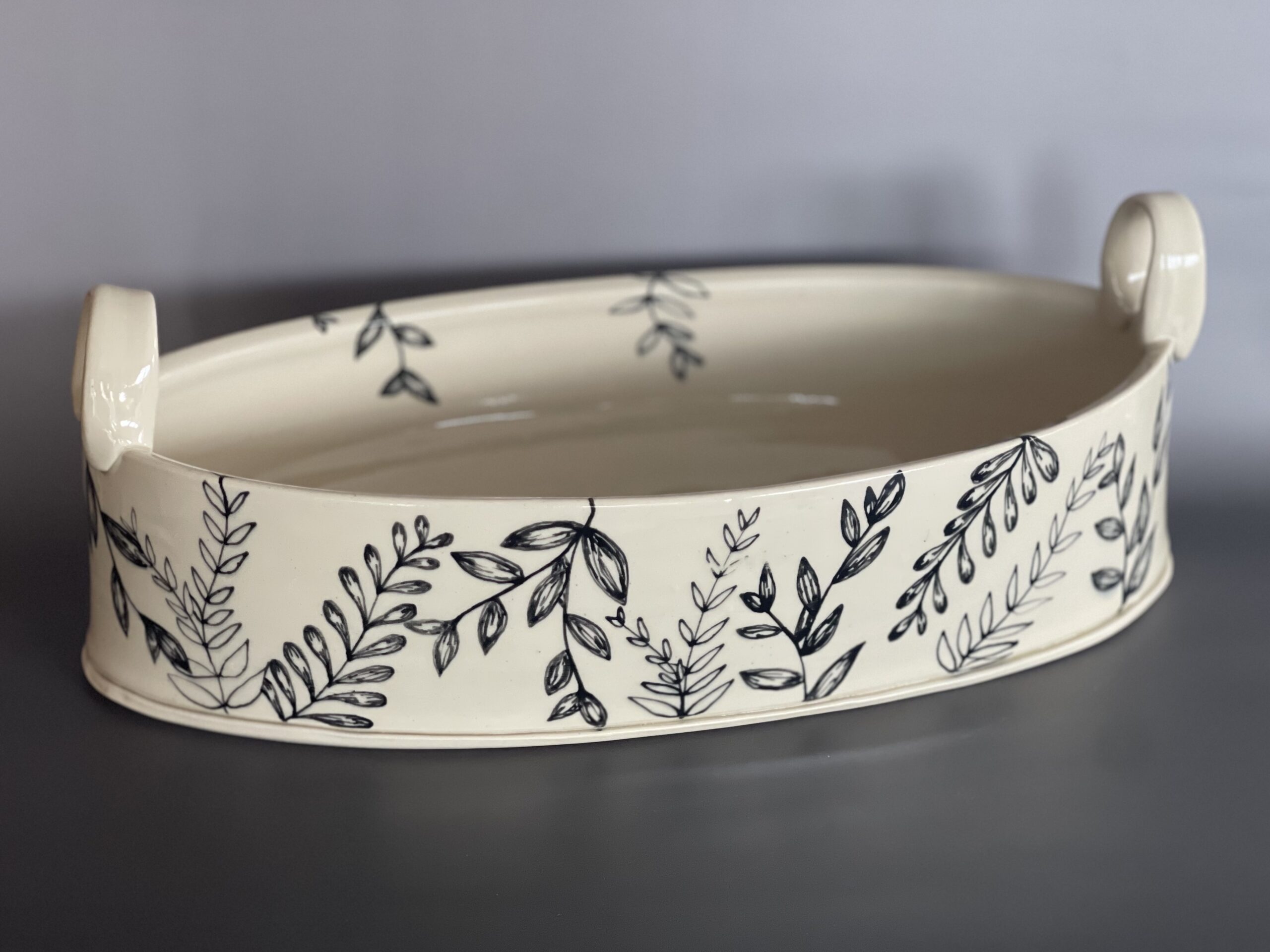 Porcelaneous stoneware, underglaze trailing