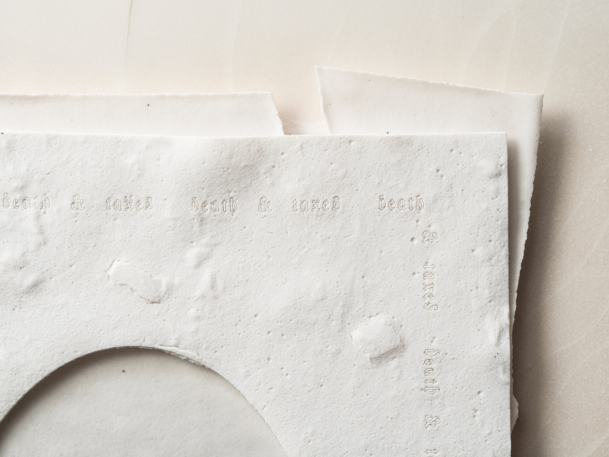 Material: Ceramic, felt, wax and wood 
Making Process:  Tape-casted, laser cutter used to outline text, then hand cut words. Felt backed and cushioned tape-casted document. Wax coated wood.

*The boarded words "death & taxes" comes from "Our new  Constitution is now established, and has an appearance that promises permanency; but in this world nothing can be said to be certain, except death and taxes.” - Benjamin Franklin