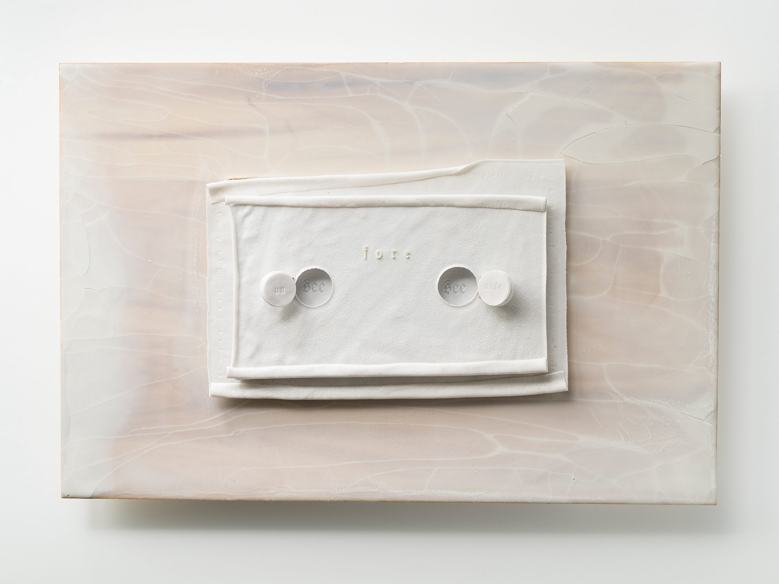 Material: Ceramic, felt, wax and wood 
Making Process:  Tape-casted, laser cutter used to engrave words. Felt backed and cushioned tape-casted document. Wax coated wood.