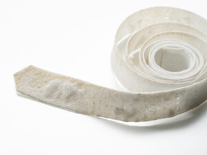 Material: Ceramic
Making Process:  Tape-casted, laser cutter used to outline text.