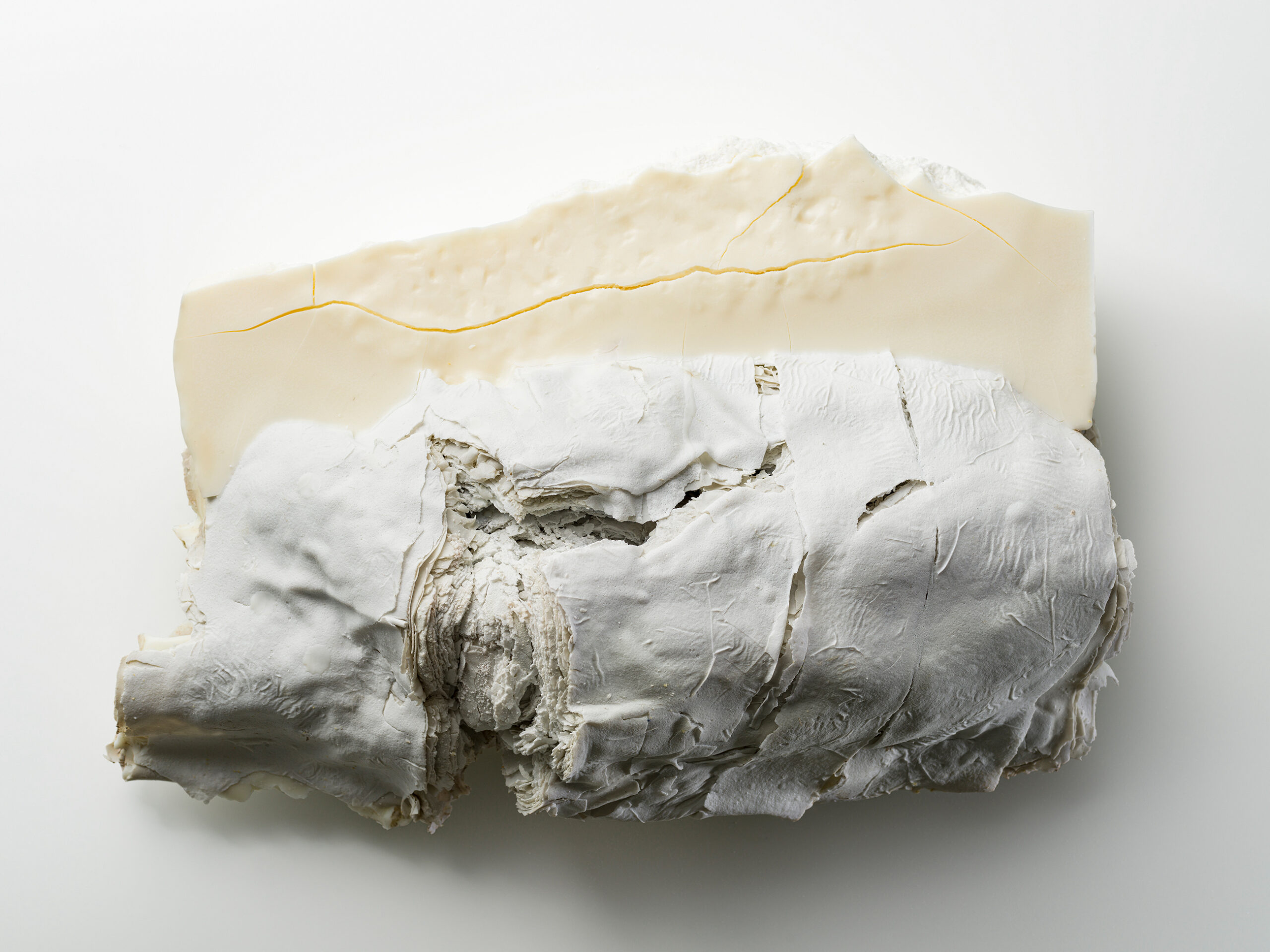 Material: Ceramic & Wax
Making Process:  Tape-casted roughly fifty layers clay then warped all together and tied tightly with a paper string.  After firing the piece is extremely fragile and unsustainable, however with wax  the work become sustained for preservation.